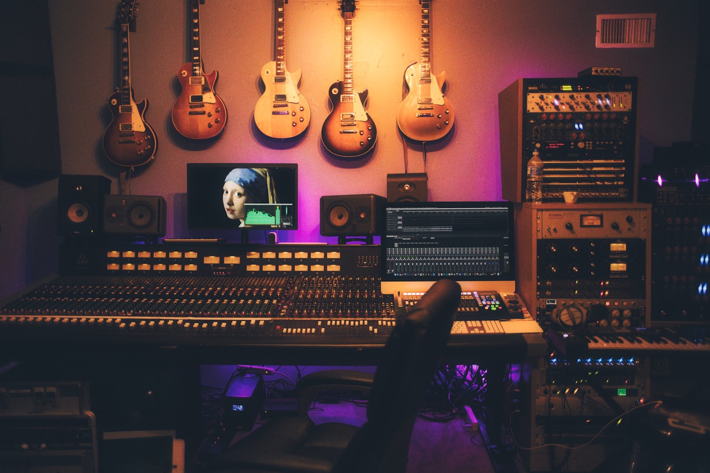 Music producer working at a professional mixing console